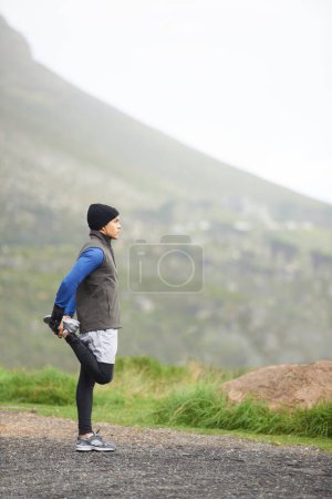 Photo for Man, stretching legs and fitness outdoor, running on mountain and nature with runner and start exercise. Workout, training and warm up in road, ready for race or cardio with endurance for health. - Royalty Free Image