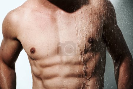 Photo for Closeup, muscular man or wet with body, hygiene or fitness with abs, routine or wellness on studio background. Person, guy or model with water, bodybuilder or cleaning with energy, chest or aesthetic. - Royalty Free Image