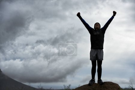 Photo for Happy man, mountain peak space or hands up for celebration in training, exercise or workout success. Excited athlete, sky mockup or hiker with energy, gratitude or freedom in nature for fitness. - Royalty Free Image