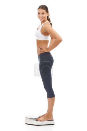 Photo for Woman, portrait and scale smile for lose weight goal target for diet achievement, mockup or white background. Female person face and happy in studio for healthy self care progress, pride or wellness. - Royalty Free Image