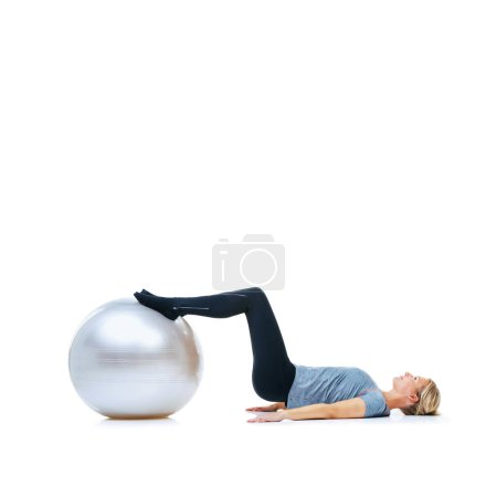 Photo for Woman, fitness and exercise ball for training, workout or health and wellness against a white studio background. Active female person or athlete on round object, gym floor or pilates on mockup space. - Royalty Free Image