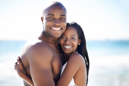 Photo for Smile, hugging and portrait of black couple at the beach for valentines day vacation, holiday or adventure. Happy, embracing and African man and woman on a date by the ocean on weekend trip together - Royalty Free Image