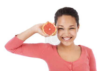 Photo for Portrait, woman and smile with grapefruit for healthy detox, vegan diet or eco nutrition in studio on white background. Happy model, fruits and sustainable benefits of vitamin c, snack or citrus food. - Royalty Free Image