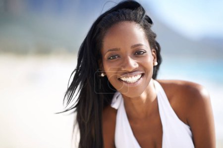 Photo for Portrait of black woman on beach, relax and smile on holiday with travel, sunshine and tropical island. Sea, happy and african girl on ocean vacation in summer with adventure, peace and calm water - Royalty Free Image