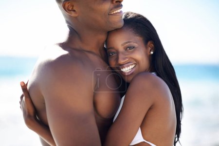 Photo for Love, hugging and young black couple at the beach for valentines day vacation, holiday or adventure. Smile, happy and African man and woman on a date by the ocean or sea on weekend trip together - Royalty Free Image