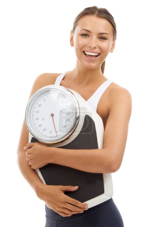 Photo for Studio portrait, smile and woman with scale to track weight loss progress, exercise or body transformation goals. Wellness, slim and model pride in BMI, diet or fitness on white background. - Royalty Free Image