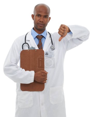 Photo for Studio, black man and portrait of doctor with thumbs down for bad medical results, medicine report or disagreement vote. Clipboard, no emoji icon or surgeon with negative feedback on white background. - Royalty Free Image
