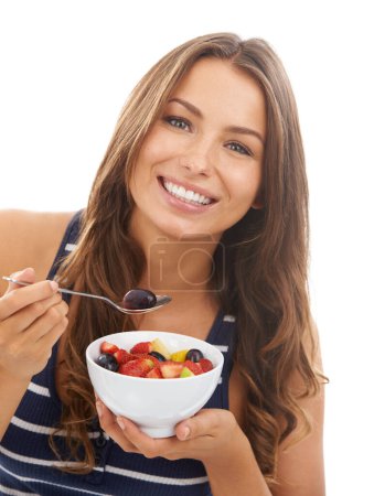 Photo for Portrait, smile and woman eating a fruit salad in bowl for diet, healthy body or nutrition. Face, food and a happy person with an organic breakfast for wellness isolated on a white studio background. - Royalty Free Image
