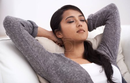 Photo for Woman, peace and hands behind head on couch in living room for happiness, relaxing and easy lifestyle in a home. Person enjoy nap on sofa, calming weekend and self care of mental health with mindset. - Royalty Free Image