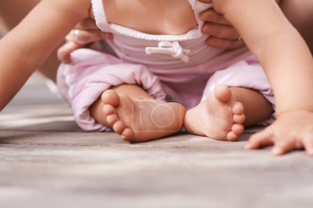 Photo for Youth, baby feet and family hands with love, bonding and child care with parenting and outdoor. Together, support and kid with newborn, holding and barefoot with trust, toddler and relax with parent. - Royalty Free Image