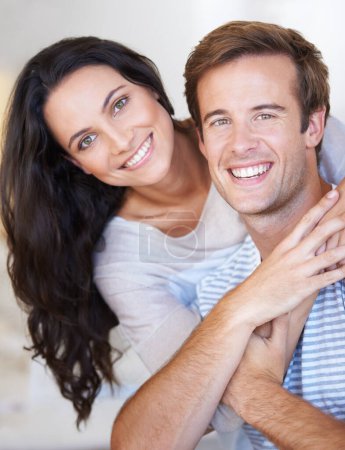Photo for Portrait, couple hug and love with care, marriage and happiness at home, healthy relationship and trust. People bonding, loyalty and connection with smile, partner and romance together at house. - Royalty Free Image