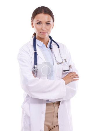 Photo for Happy woman, portrait and professional doctor standing with arms crossed on a white studio background. Female person, surgeon or medical employee with stethoscope in confidence for healthcare career. - Royalty Free Image