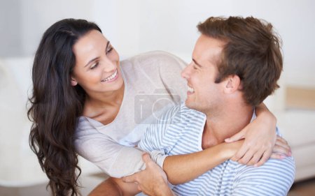 Photo for Happy couple hug, relax and love with trust, marriage and healthy relationship with affection at home. People bonding, loyalty and connection with smile, partner and romance together at house. - Royalty Free Image