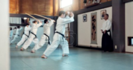 Photo for Teacher, students and taekwondo, karate and men in self defense class for learn to fight and muay thai for discipline. Exercise, traditional Asian sports and health, action and challenge in lesson. - Royalty Free Image