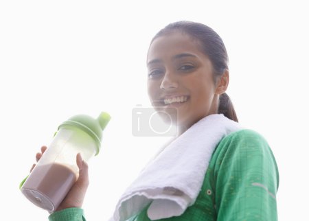 Photo for Sports, drink and portrait of happy woman with protein shake for health, wellness and energy benefits in exercise. Outdoor, fitness or person with smoothie for nutrition in diet on white background. - Royalty Free Image