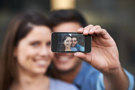 Photo for Portrait, selfie of happy couple and phone screen, love and care in relationship. Man, woman and profile picture of face on smartphone, memory or photo together on social media on valentines in home. - Royalty Free Image