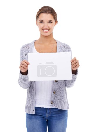 Photo for Mockup, poster or portrait of woman with sign, broadcast space or advertising promotion in studio on white background. Happy model, presentation or paper board of feedback, offer or launch commercial. - Royalty Free Image
