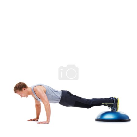 Photo for Man, fitness and push ups with bosu ball for exercise, workout or training on a white studio background. Active male person lifting body weight for strength, muscle or strong arms on mockup space. - Royalty Free Image