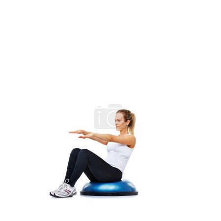 Photo for Woman, fitness and sitting on balance ball for exercise, workout or training on a white studio background. Active person on half round object for pilates, practice or strong core on mockup space. - Royalty Free Image