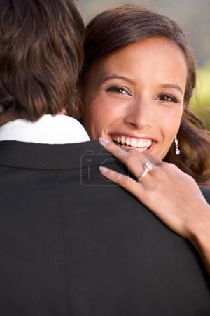 Photo for Bride, portrait and embrace on wedding day for love, support and excited for marriage and commitment. Happy couple, romance and hugging at outdoor ceremony, loyalty and pride for ring and partnership. - Royalty Free Image