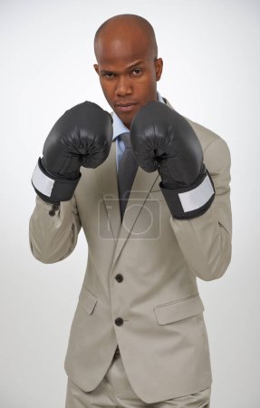 Photo for Boxing gloves, studio portrait and professional black man, fighter or lawyer to fight for government law. Battle, boxer and African agent for legal defence, protection or security on white background. - Royalty Free Image