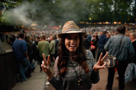 Photo for Happy woman, portrait and peace sign at music festival for party, event or DJ concert in nature. Excited female person smile in night crowd or audience at carnival, performance or summer fest outside. - Royalty Free Image
