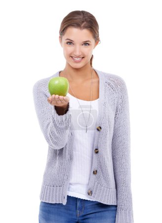 Photo for Woman, portrait and apple, nutrition and health with snack or meal, happy with diet for weight loss on white background. Healthy food, wellness and green fruit, vegan and organic with smile in studio. - Royalty Free Image