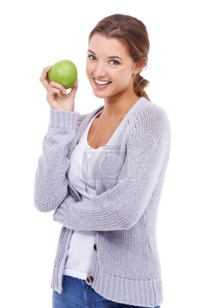 Photo for Woman, portrait and apple for nutrition in studio, organic fiber and fruit for wellness. Female person, vitamins and minerals for healthy living, snack and vegan food on white background for diet. - Royalty Free Image