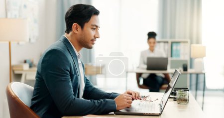 Photo for Man at desk, laptop and typing in coworking space, market research and online schedule at consulting agency. Office, admin and happy businessman at computer writing email review, feedback or report - Royalty Free Image