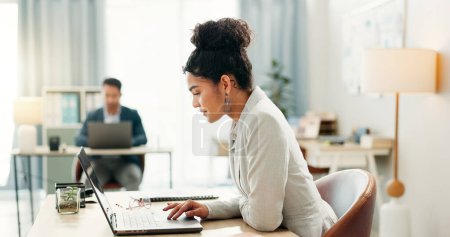 Photo for Woman with desk, laptop and typing in coworking space, market research and online schedule at consulting agency. Office, admin business and girl at computer writing email review, feedback or report - Royalty Free Image