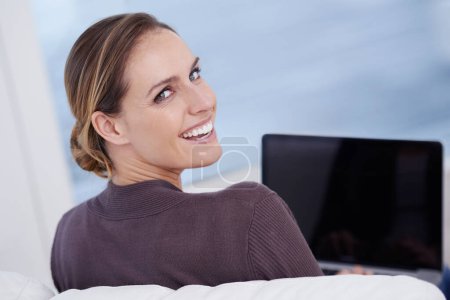 Photo for Woman, portrait and laptop for remote work from home with back, smile and typing for online blog. Journalist, writer or content creator with freelance service, editor or copywriting with computer. - Royalty Free Image
