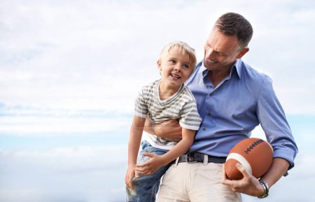 Photo for Blue sky, football and father with young son on outdoor adventure, playful or excited mockup space. Relax, bonding together and family, happy child and dad on summer holiday for fun, game and smile - Royalty Free Image