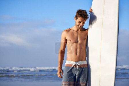 Photo for Happy, surfing and man with surfboard at beach for, waves on summer vacation, weekend and holiday by sea. Travel, nature and person by ocean for water sports, adventure and fun hobby in Australia. - Royalty Free Image