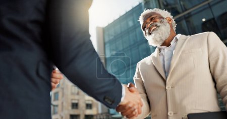 Photo for Outdoor, business people and men with handshake, greeting and contract with lens flare, corporate and smile. Staff, employees in a city and coworkers with hello, partnership and about us with friends. - Royalty Free Image