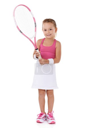 Photo for Tennis, sports and portrait of child on a white background for training, workout and exercise. Fitness, happy and isolated young girl with racket for hobby, activity and fun for wellness in studio. - Royalty Free Image