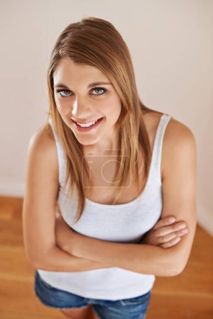 Photo for Woman, portrait and beauty confidence with smile for good mood holiday or relax, cosmetics or vacation. Female person, face and healthy with crossed arms from above for wellness, wall or happy. - Royalty Free Image