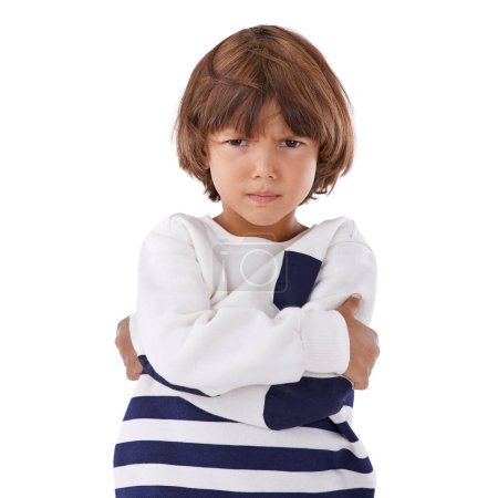 Photo for Boy, child and angry in portrait with arms crossed, frustrated and stress, emotion and frown on white background. Youth, upset or disappointed with tantrum, bad attitude with problem in studio. - Royalty Free Image