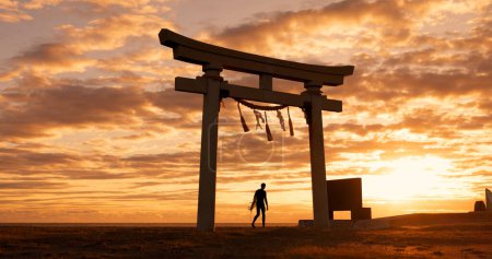 Photo for Torii gate, sunset sky and man at ocean with surfboard, spiritual history and travel adventure in Japan. Shinto architecture, Asian culture and calm beach in Japanese nature with sacred monument - Royalty Free Image