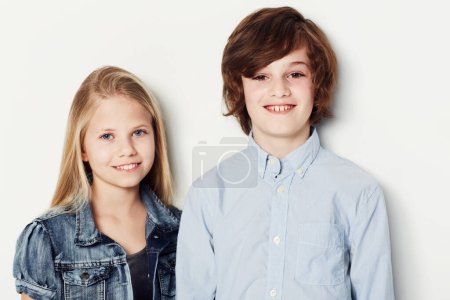 Photo for Happy, portrait and children or siblings on a white background for fashion, style and clothes. Smile, cute and a boy, girl and kids in a studio for fashionable youth and clothing on a backdrop. - Royalty Free Image