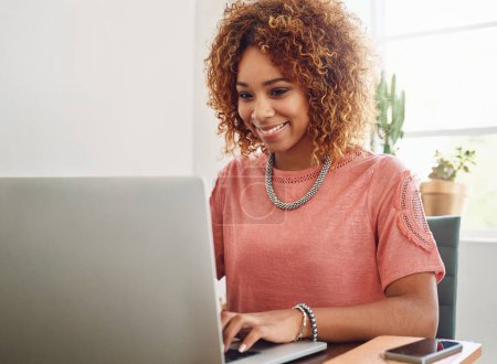 Photo for Office, typing or happy woman with laptop for research, technology or online business on website. African person, smile or female worker in workplace working on update, networking or reading news. - Royalty Free Image