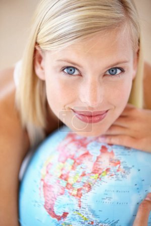 Photo for Woman, travel and globe with portrait and happy from earth day, holiday or international vacation. Smile, world and map for learning and geography with a female person and choice with the planet. - Royalty Free Image