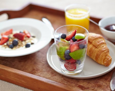 Photo for Wellness, food and closeup of breakfast tray with muesli for balance, benefits or gut health. Fruit, zoom and croissant with vitamins for diet, nutrition or healthy eating, brunch or superfoods salad. - Royalty Free Image