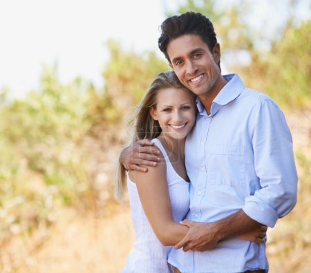 Photo for Happy couple, portrait and hug in nature for embrace, bonding or love in support or outdoor affection. Face of young woman and man smile for comfort, trust or romance in forest or woods together. - Royalty Free Image