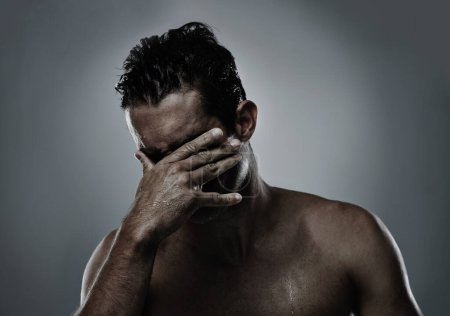 Photo for Man, hand and face hiding in studio for embarrassed shame on grey background or topless, unhappy or mockup space. Male person, model and fingers for bad decision or fail mistake, palm or distress. - Royalty Free Image