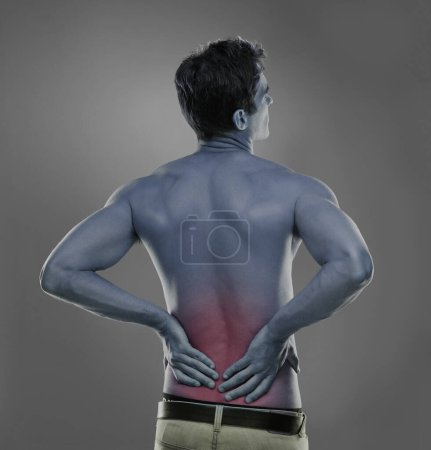 Photo for Back pain, injury crisis and studio man with medical emergency, sore spine or fibromyalgia. Backache, red glow and person massage joint ache, inflammation or bad muscle strain on grey background. - Royalty Free Image