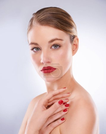Photo for Woman, portrait and cosmetics in studio with red lipstick for makeup, beauty and aesthetic with nail polish. Model, person and confidence with skincare, glowing face and manicure on white background. - Royalty Free Image