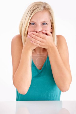 Photo for Woman, gossip and cover mouth in portrait with funny, surprise and announcement in studio on white background. Wow, shocked and girl with hands on face for crazy fake news, secret or story of drama. - Royalty Free Image