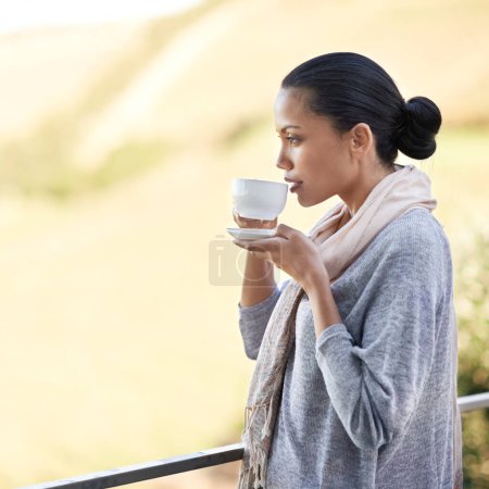 Photo for Woman, drink coffee on balcony and outdoor to relax with warm beverage and morning routine for zen in nature. Peace, calm and espresso for caffeine, view and mockup space with tea cup in countryside. - Royalty Free Image