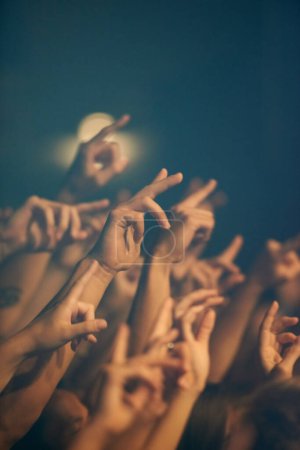 Photo for Rock concert, hands and music festival with people, event and party with fun and entertainment. Freedom, energy or crowd screaming with excitement and social with audience or group with performance. - Royalty Free Image