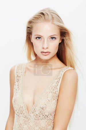 Photo for Portrait, model and lace lingerie in studio, confident and trendy fashion with body care. Young woman, face and cosmetics in elegant top for underwear, blonde hair and make up by white background. - Royalty Free Image